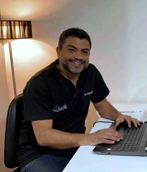Dr. Alain Jean Sleiman, physiotherapist, working at his desk